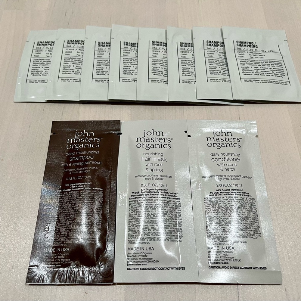 11 packets of Le Labo shampoo and John masters hair care products